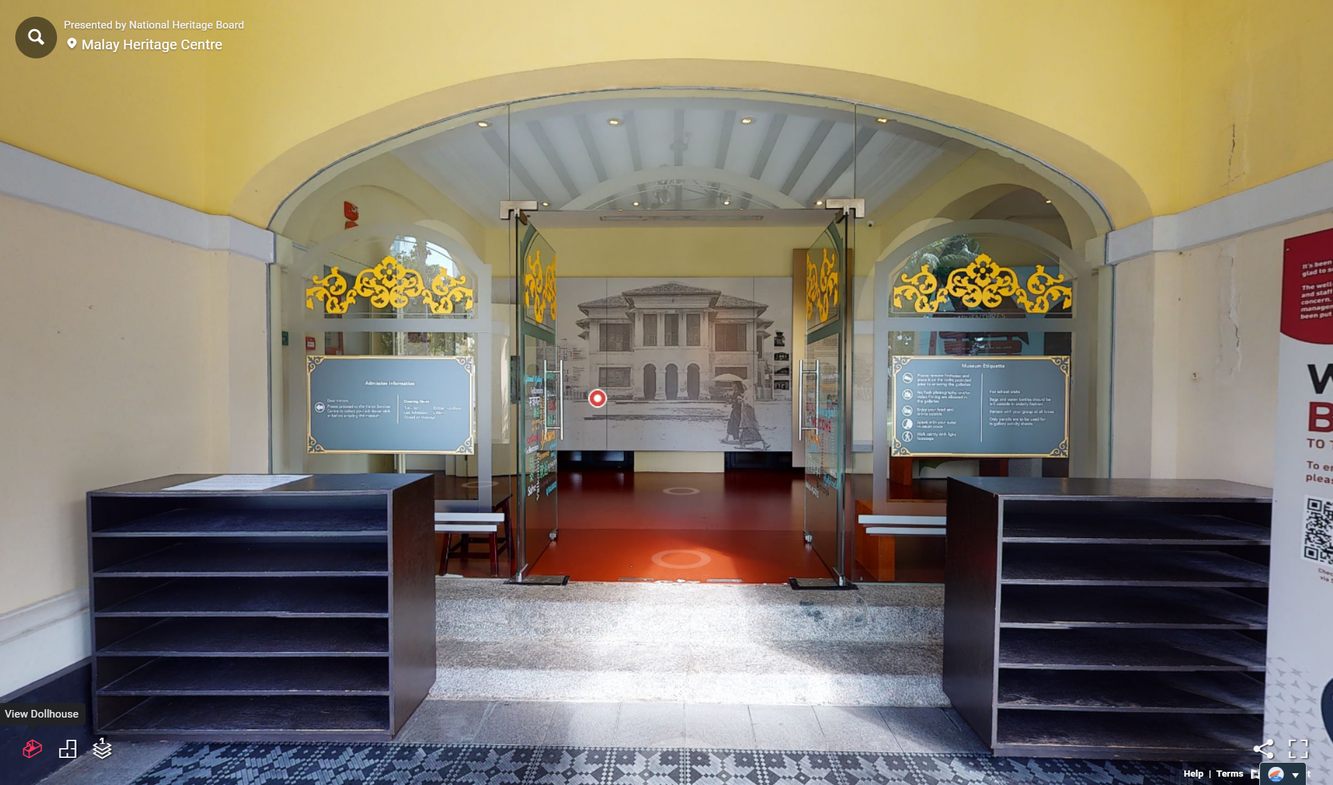 Virtual tour of Malay Heritage Centre entrance with glass doors, yellow arched ceiling, and gold floral decorations.